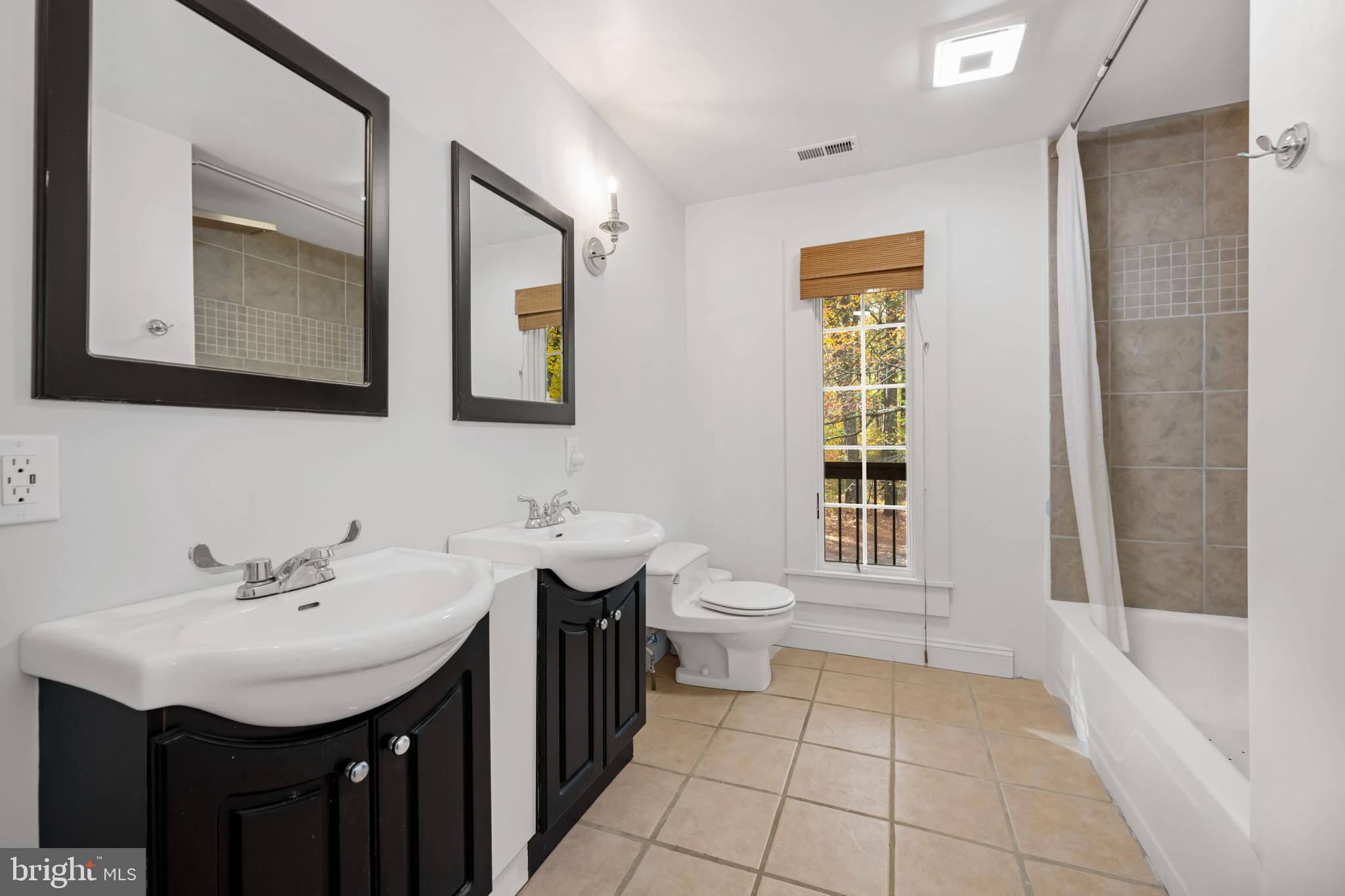 2669 Ocean Gateway Trappe, MD 21673 - Photo 40 of 47 a bathroom with a sink and a mirror