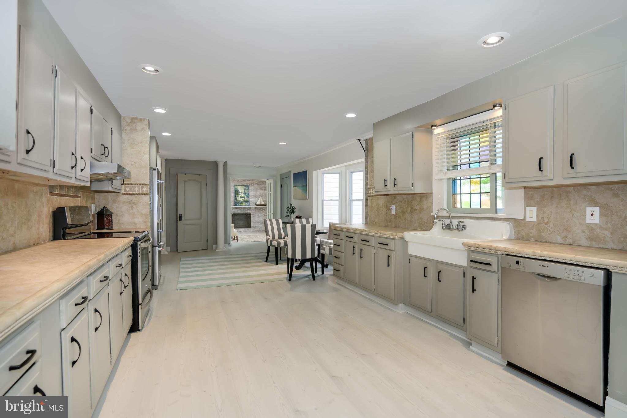 2669 Ocean Gateway Trappe, MD 21673 - Photo 5 of 47 a kitchen with cabinets appliances and a window