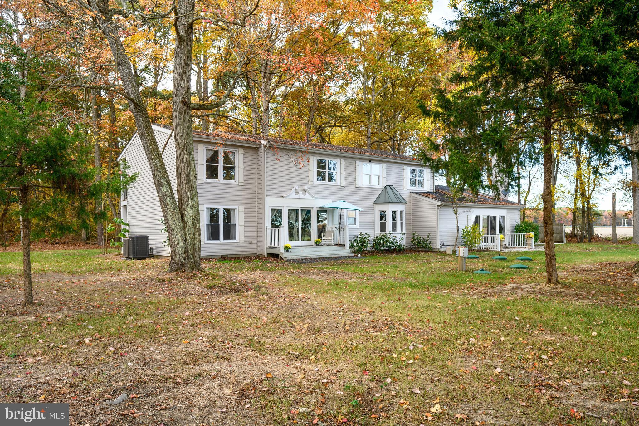 2669 Ocean Gateway Trappe, MD 21673 - Photo 9 of 47 a view of a yard in front of a house with large trees