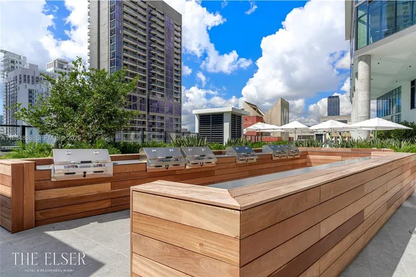 a view of an outside dining space with furniture