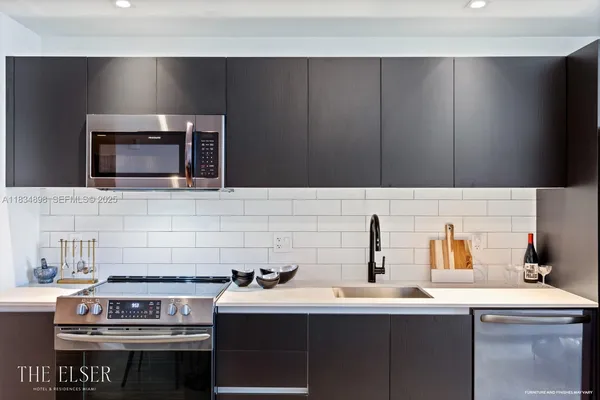 a kitchen with a stove and a sink
