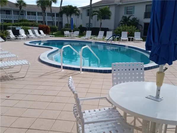 a view of a swimming pool with a patio