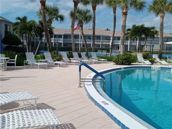 a view of swimming pool with outdoor seating