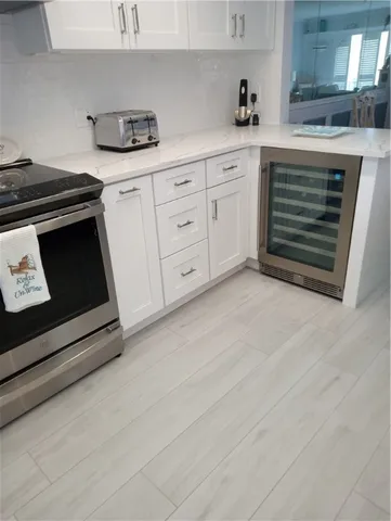 a stove top oven sitting inside of a kitchen
