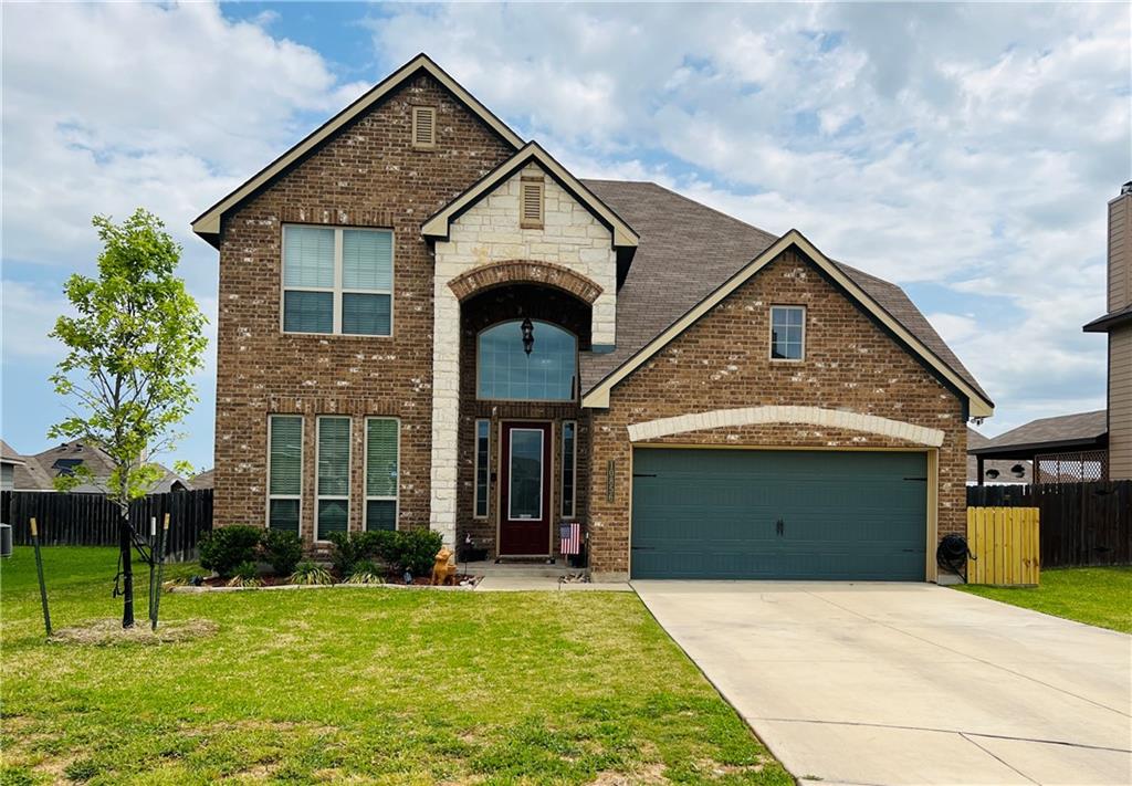 10856 Burnham Drive Waco, TX 76708 - Photo 1 of 1 a front view of a house with a yard