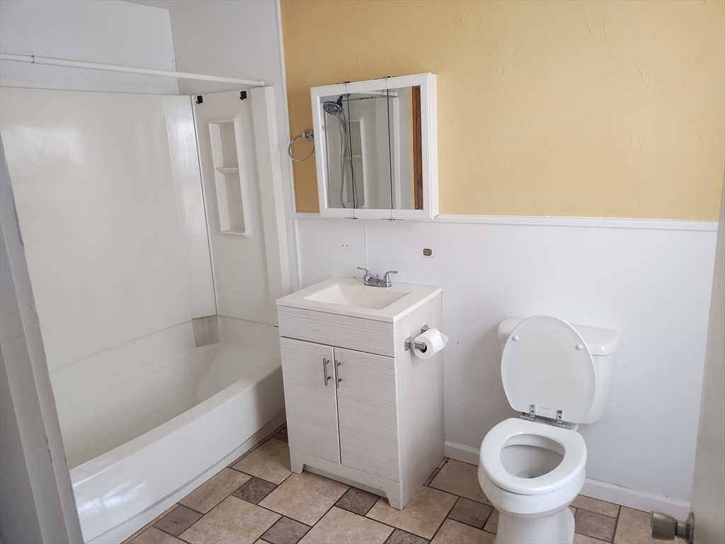429 Main Street, Unit 429 Hardwick, MA 01031 - Photo 5 of 10 a bathroom with a sink a toilet and a mirror