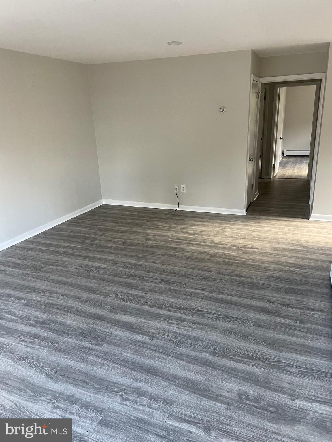123 4th Avenue, Unit B Broomall, PA 19008 - Photo 2 of 7 a view of an empty room with wooden floor