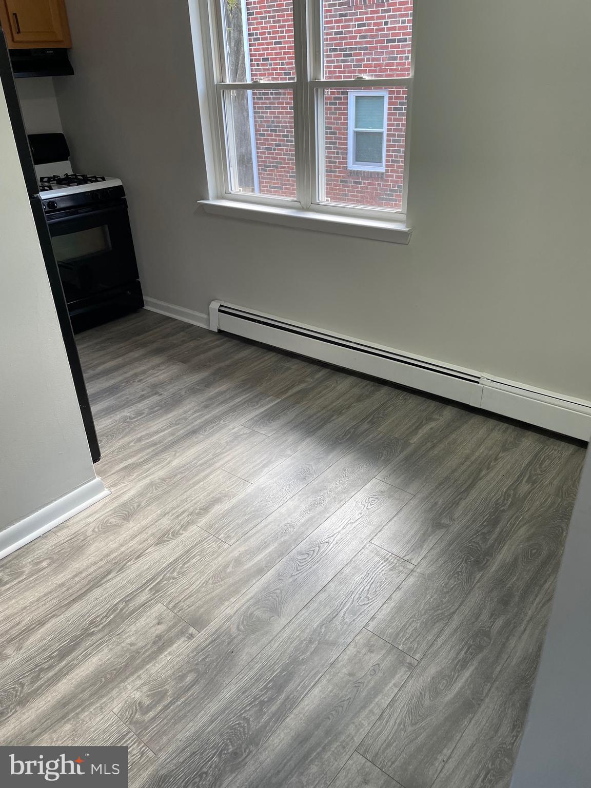 123 4th Avenue, Unit B Broomall, PA 19008 - Photo 3 of 7 a view of a room with wooden floor and a window