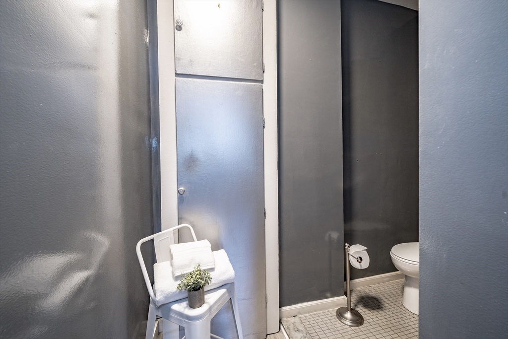 140 Chestnut Street, Unit 310 Springfield, MA 01103 - Photo 16 of 25 a bathroom with a toilet and a sink