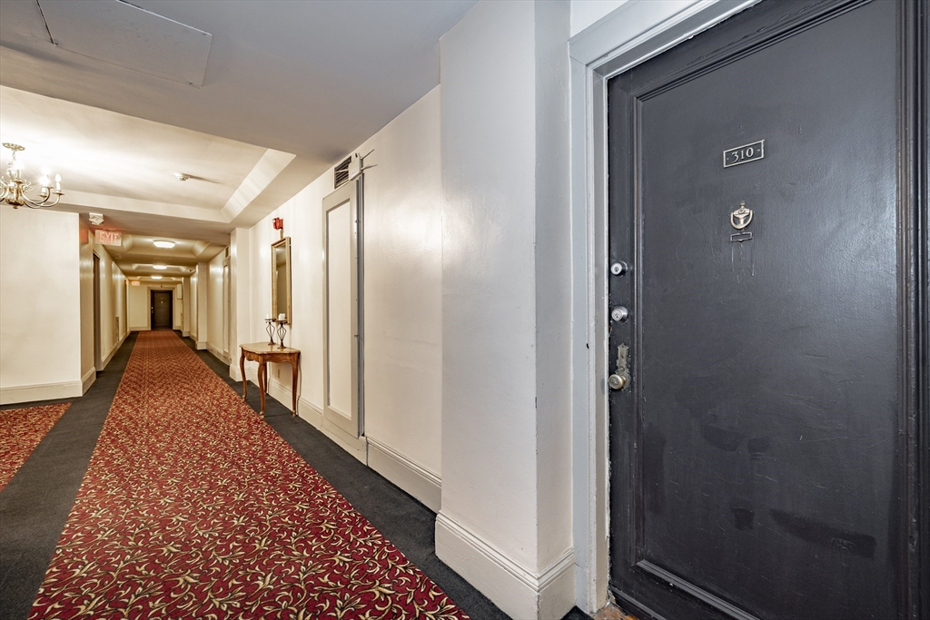 140 Chestnut Street, Unit 310 Springfield, MA 01103 - Photo 17 of 25 a view of hallway with wooden floor