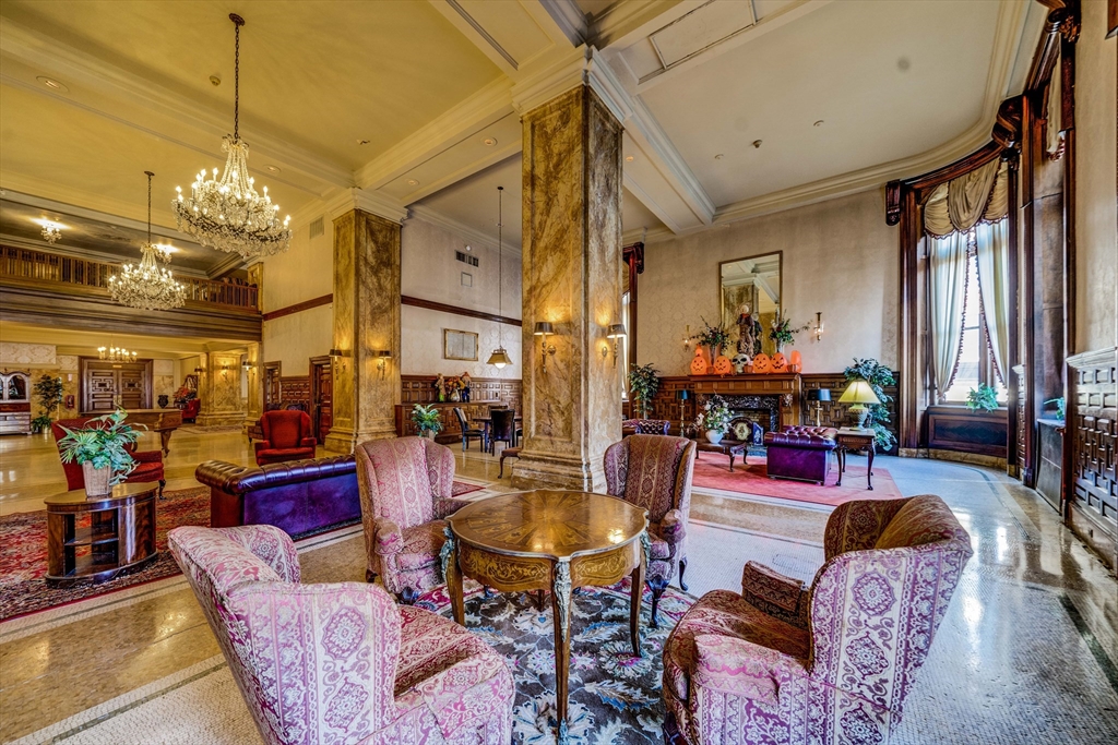 140 Chestnut Street, Unit 310 Springfield, MA 01103 - Photo 19 of 25 a living room with lots of furniture and a chandelier