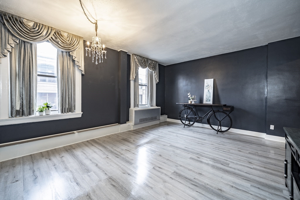 140 Chestnut Street, Unit 310 Springfield, MA 01103 - Photo 7 of 25 a view of a room with lots of windows and furniture
