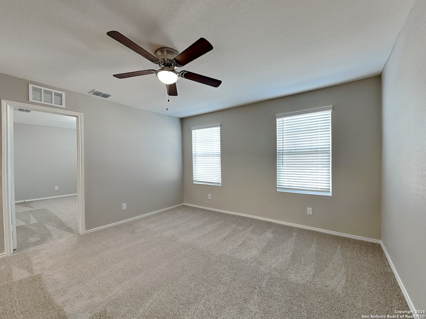 5206 Winding Street St. Hedwig, TX 78152 - Photo 14 of 17 a view of room with a ceiling fan and window