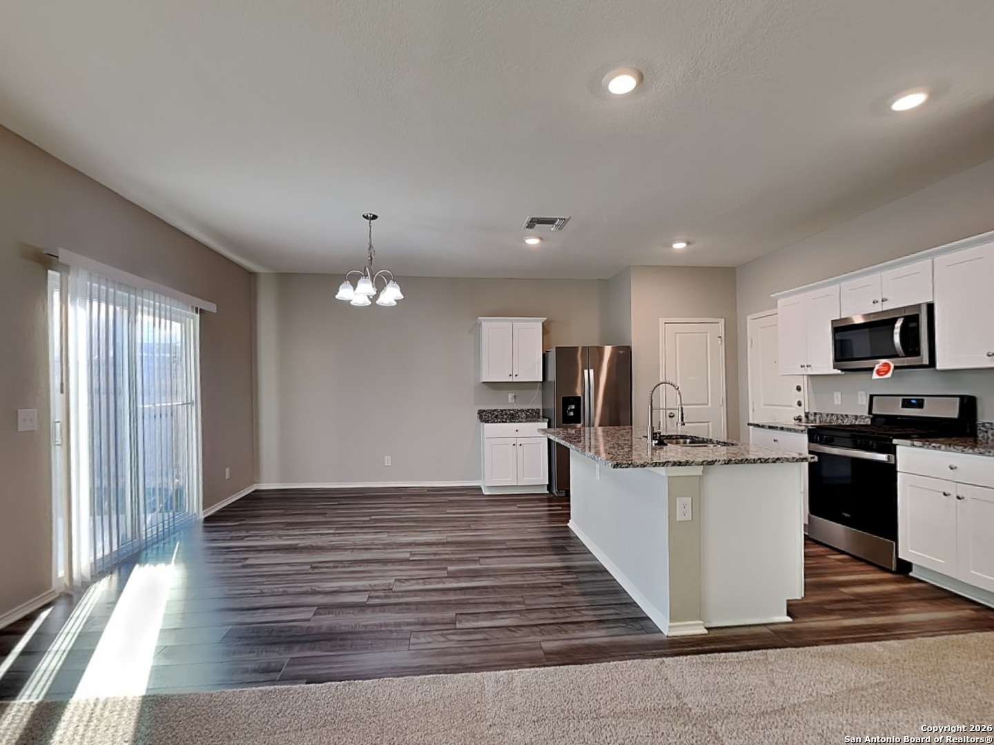 5206 Winding Street St. Hedwig, TX 78152 - Photo 3 of 17 a large kitchen with cabinets