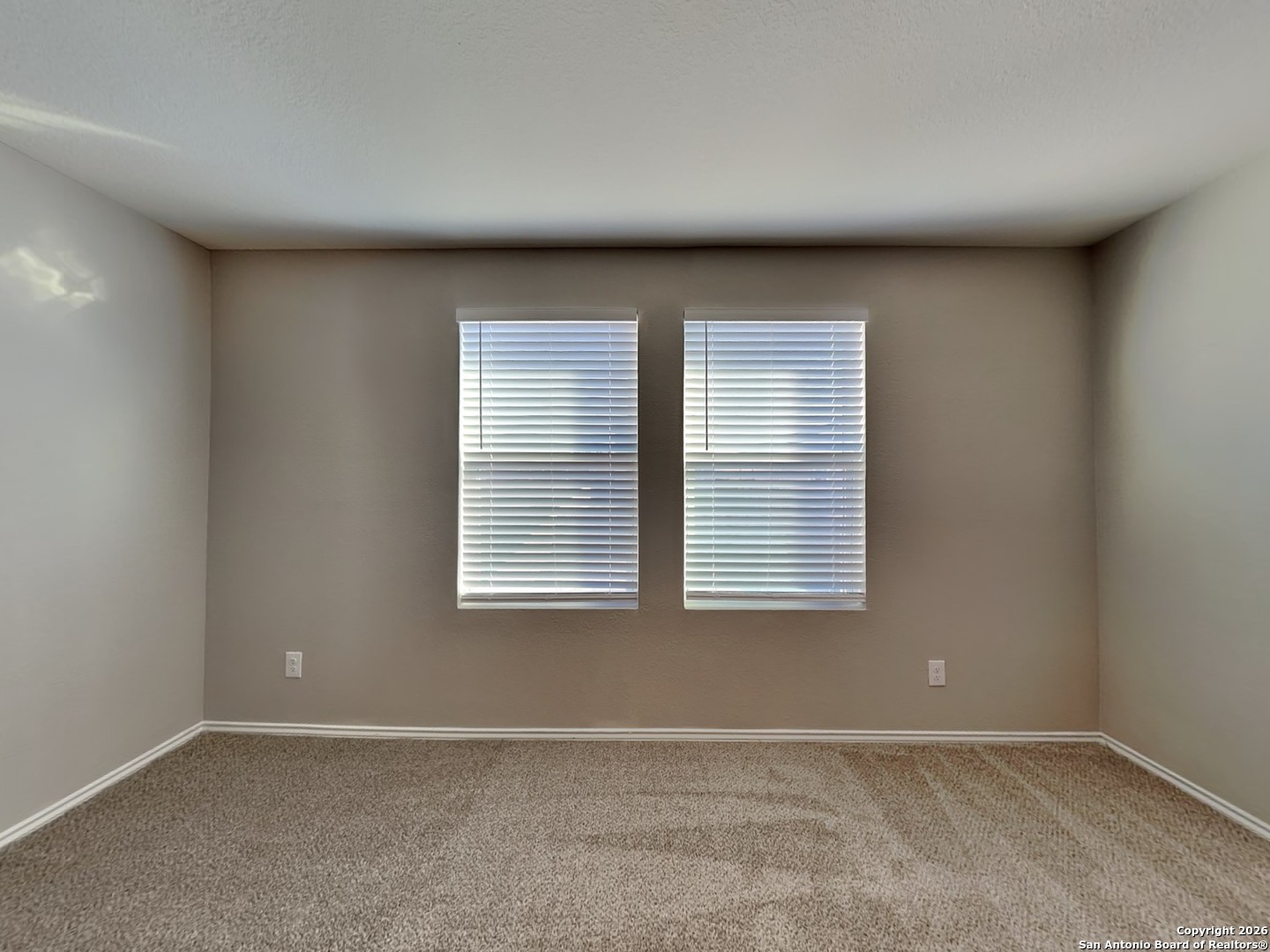 5206 Winding Street St. Hedwig, TX 78152 - Photo 5 of 17 an empty room with a window