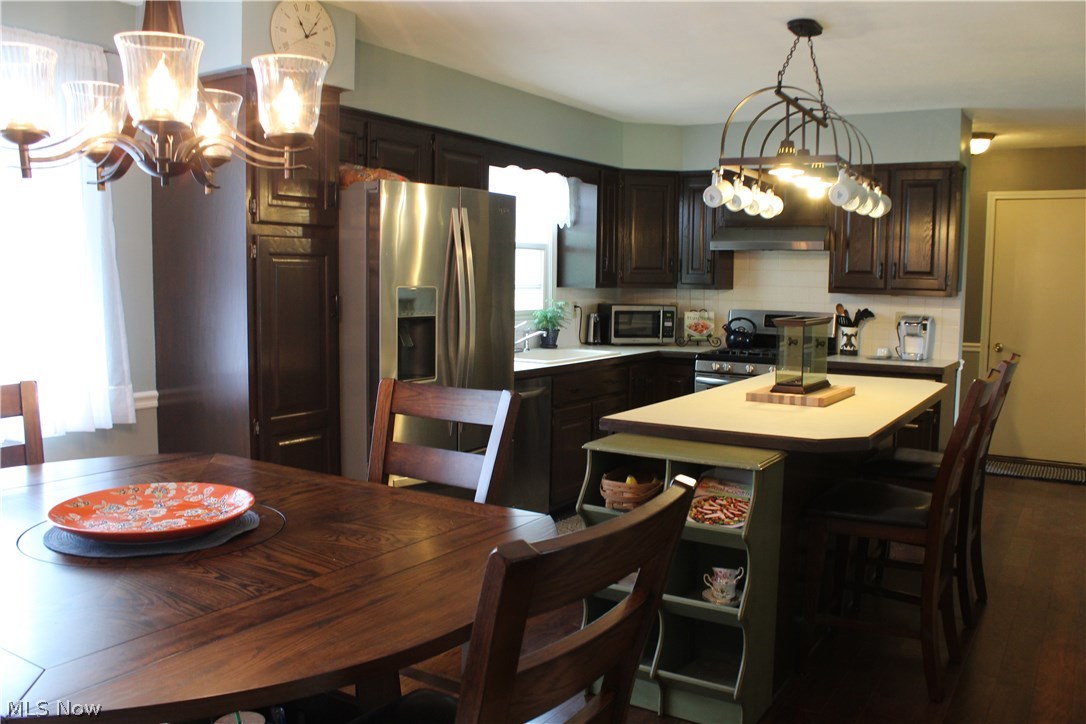 7897 Tower Road Seville, OH 44273 - Photo 8 of 24 Open kitchen features new lighting and stainless steel appliances