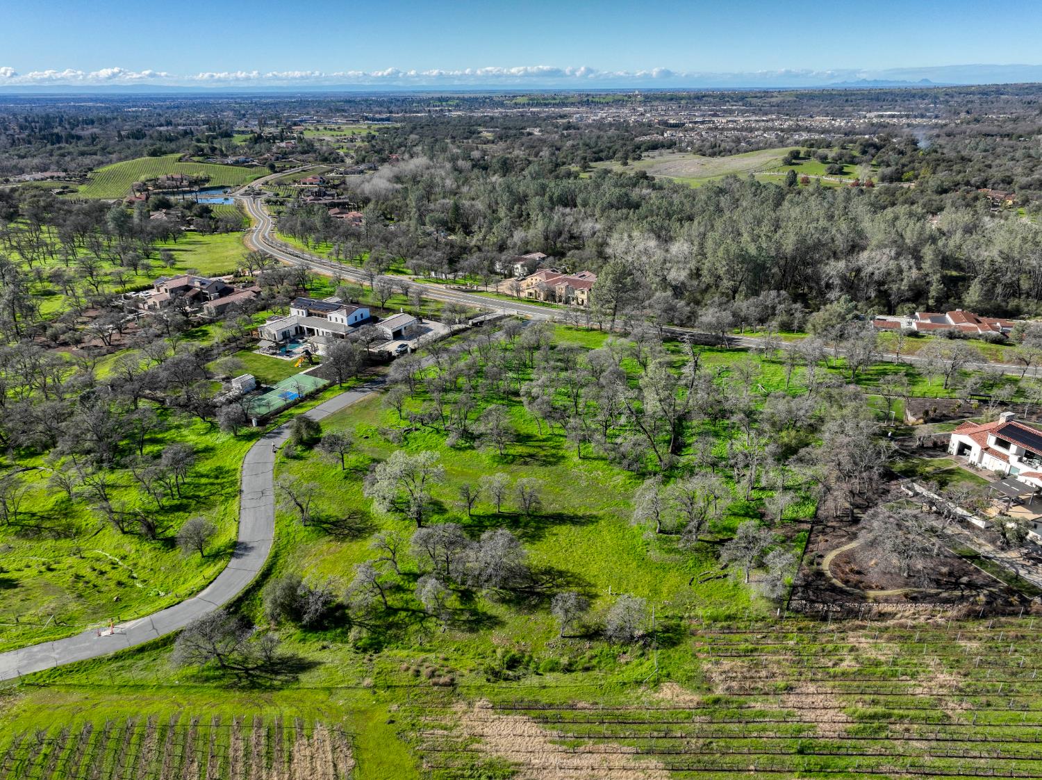 6806 Rutherford Canyon Road Loomis, CA 95650 - Photo 19 of 36 a view of a city with lush green forest