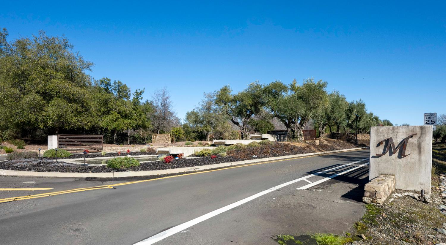 6806 Rutherford Canyon Road Loomis, CA 95650 - Photo 2 of 36 a view of a city street with a building and trees in the background