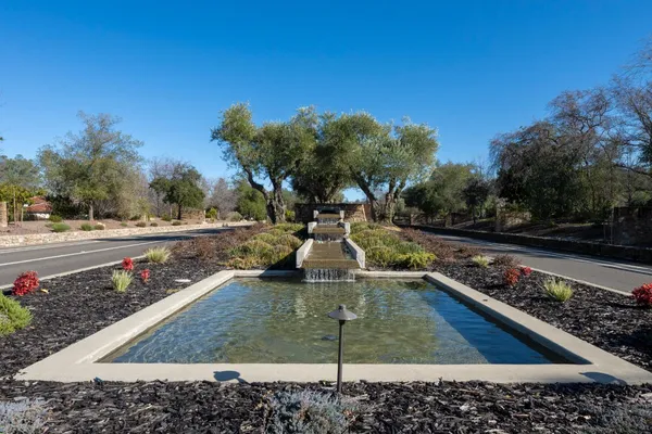 a view of a swimming pool with a patio