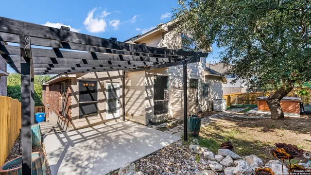 a view of a chairs and table in the patio