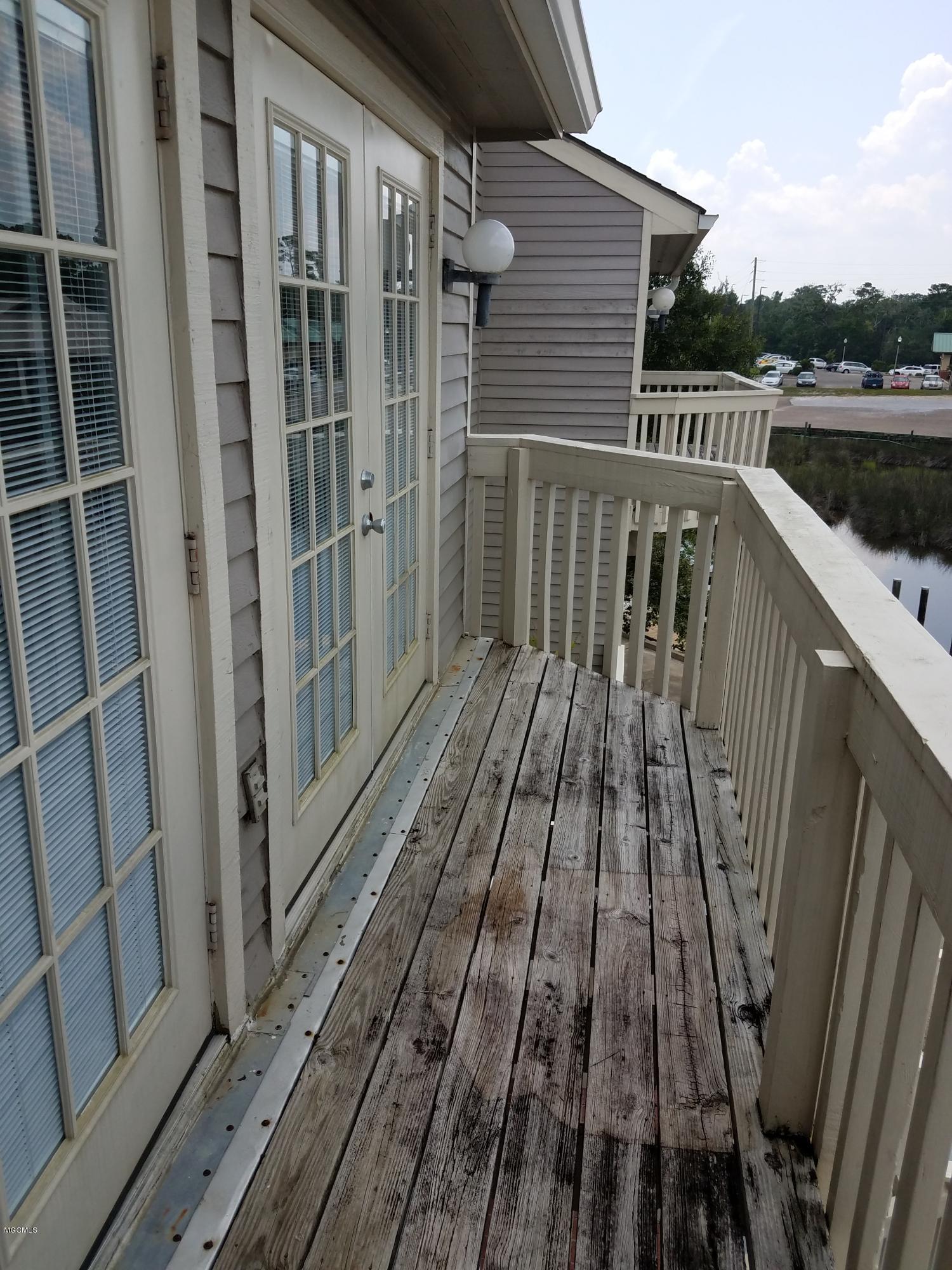717 Bienville Boulevard, Unit B4 Ocean Springs, MS 39564 - Photo 20 of 24 DECK OFF MASTER BEDROOM