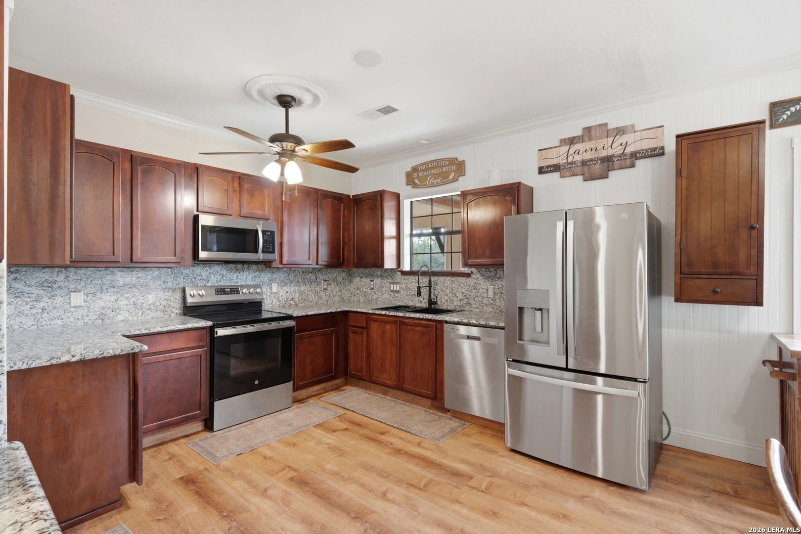423 Las Hadas Spring Branch, TX 78070 - Photo 12 of 29 a kitchen with stainless steel appliances granite countertop a refrigerator a stove top oven a sink and dishwasher