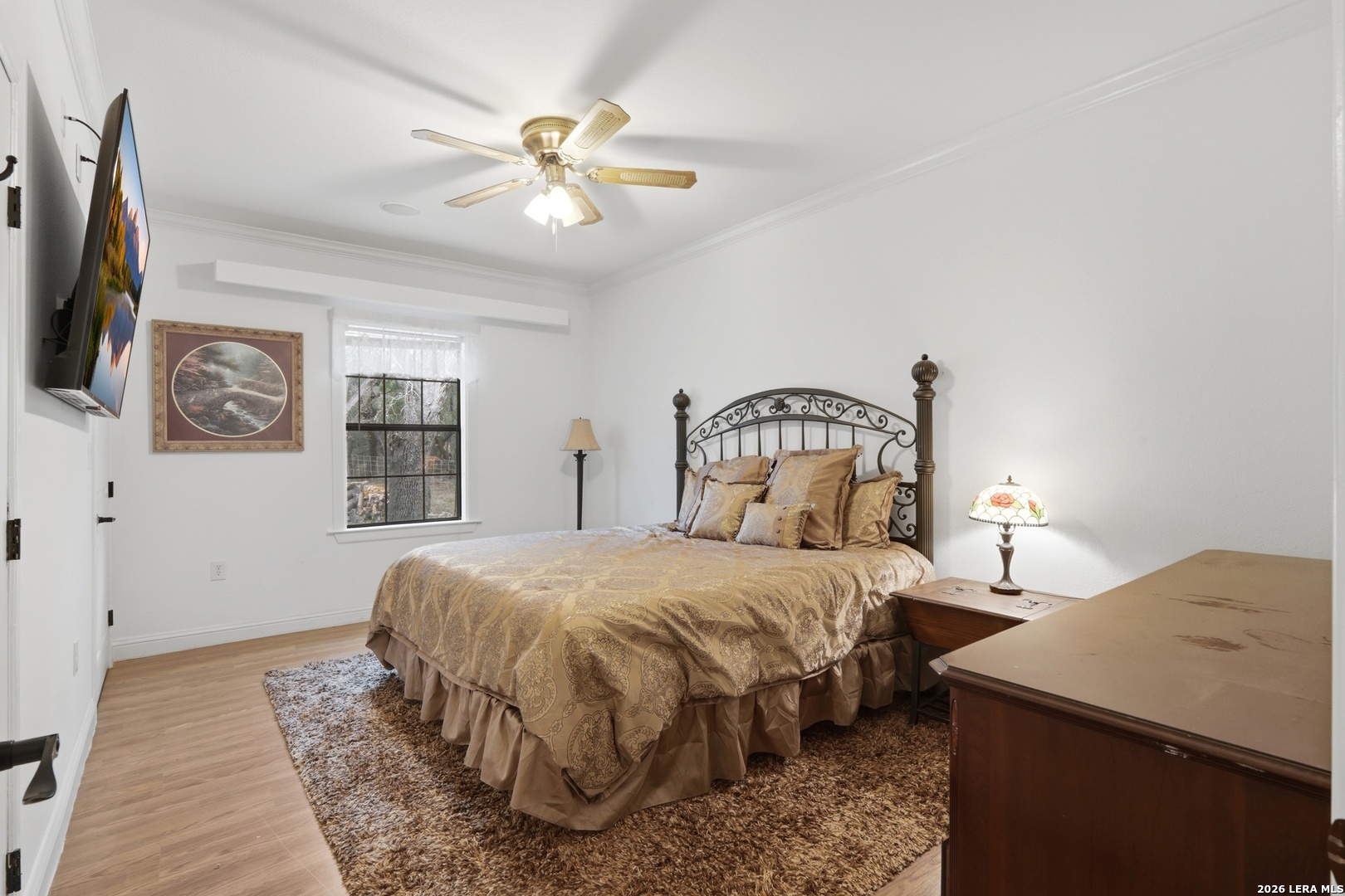 423 Las Hadas Spring Branch, TX 78070 - Photo 15 of 29 a bedroom with a bed and a chandelier