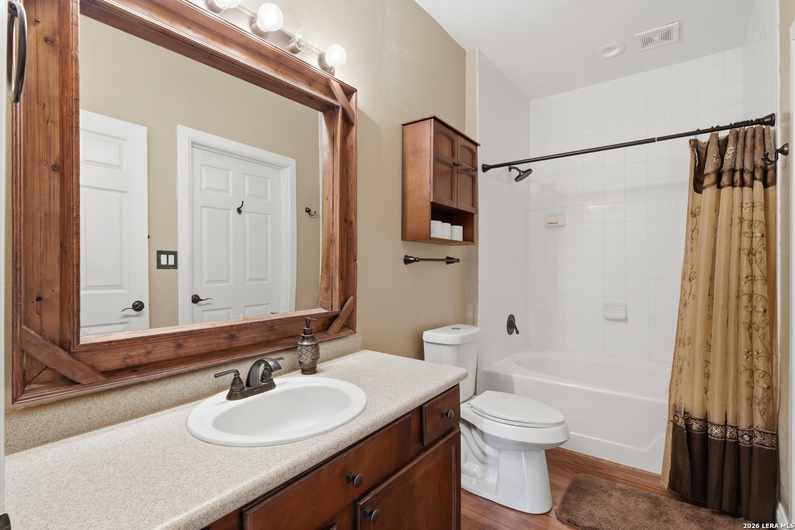 423 Las Hadas Spring Branch, TX 78070 - Photo 16 of 29 a bathroom with a granite countertop sink toilet a mirror a vanity and shower