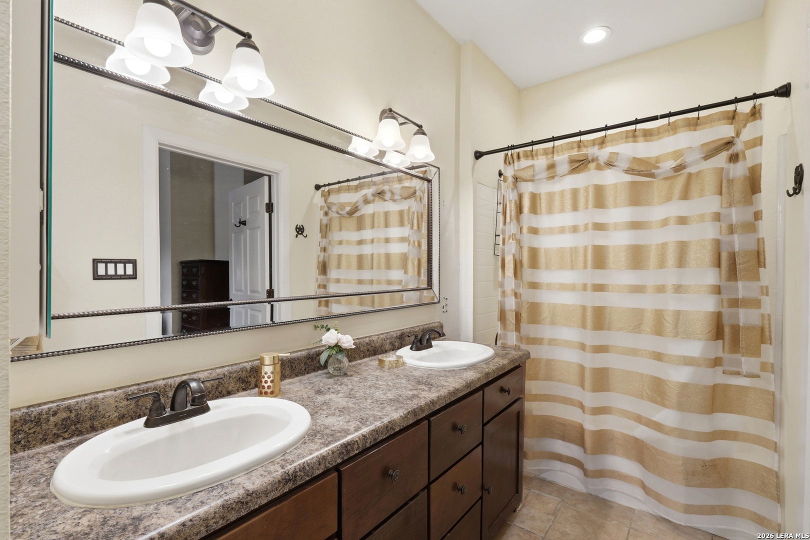 423 Las Hadas Spring Branch, TX 78070 - Photo 20 of 29 a bathroom with a granite countertop sink a mirror a and a shower