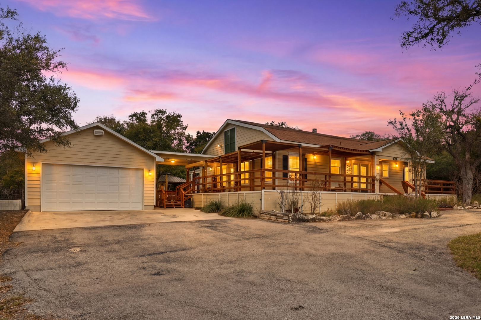 423 Las Hadas Spring Branch, TX 78070 - Photo 2 of 29 a view of a large house with a yard covered in snow