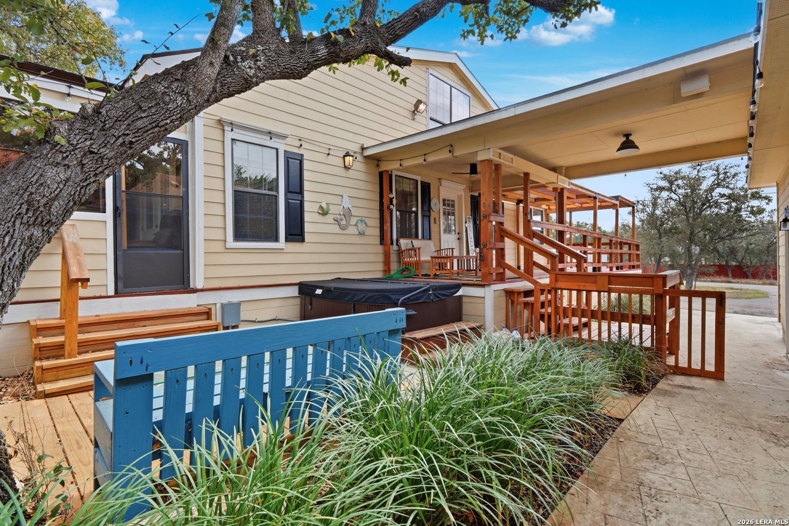 423 Las Hadas Spring Branch, TX 78070 - Photo 21 of 29 a front view of a house with a garden