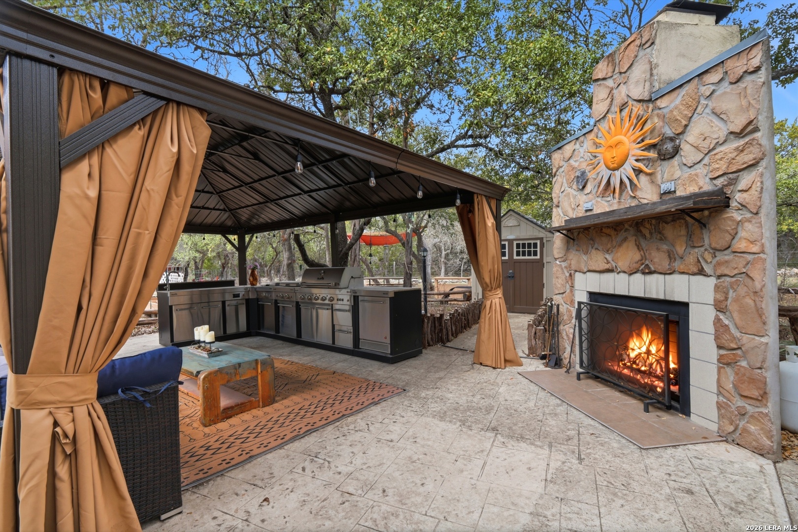 423 Las Hadas Spring Branch, TX 78070 - Photo 5 of 29 a view of a porch with furniture and a fireplace