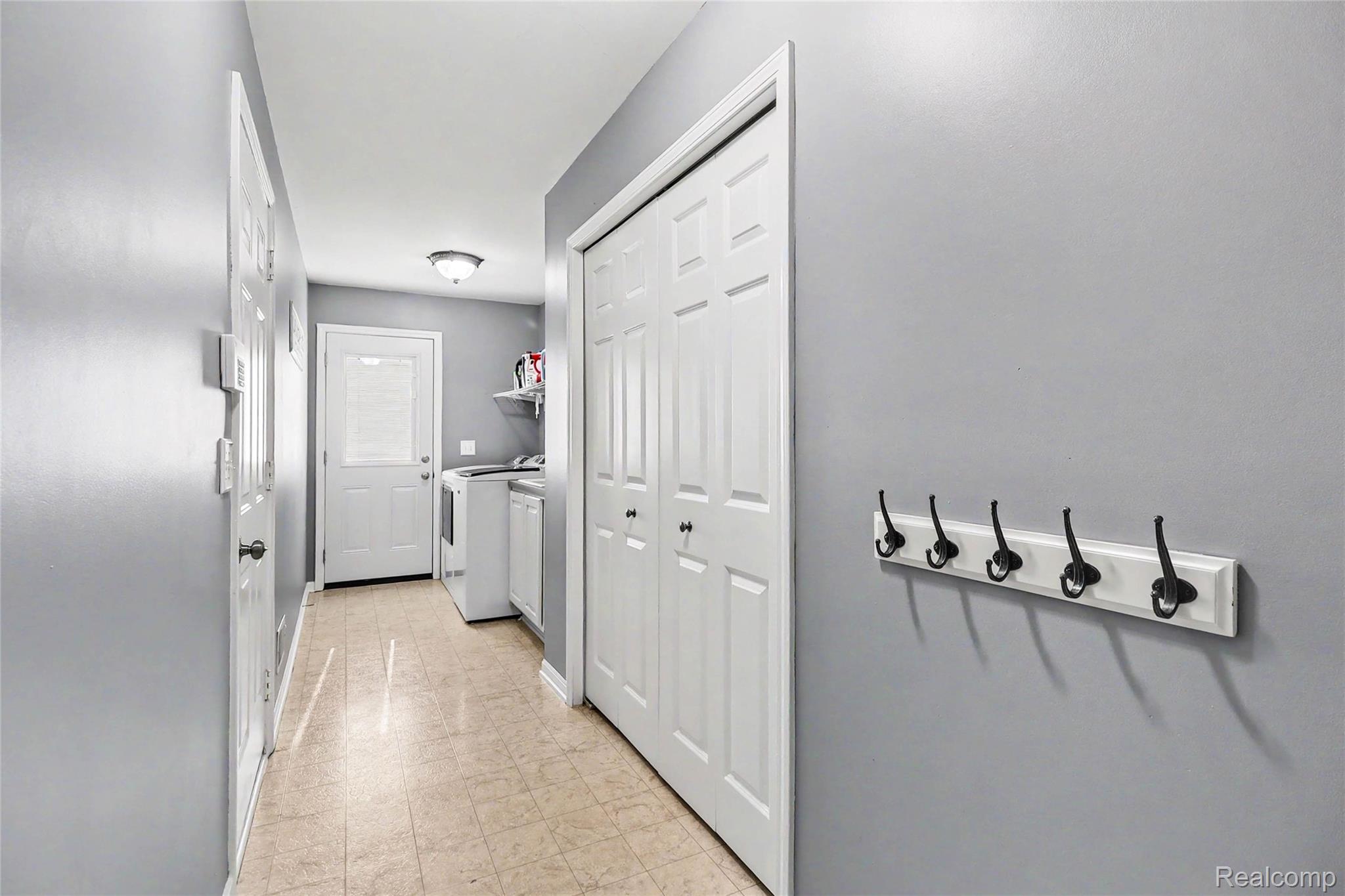 2548 Empire Court Rochester, MI 48309 - Photo 33 of 40 Hallway featuring light gray walls and light-toned tile flooring