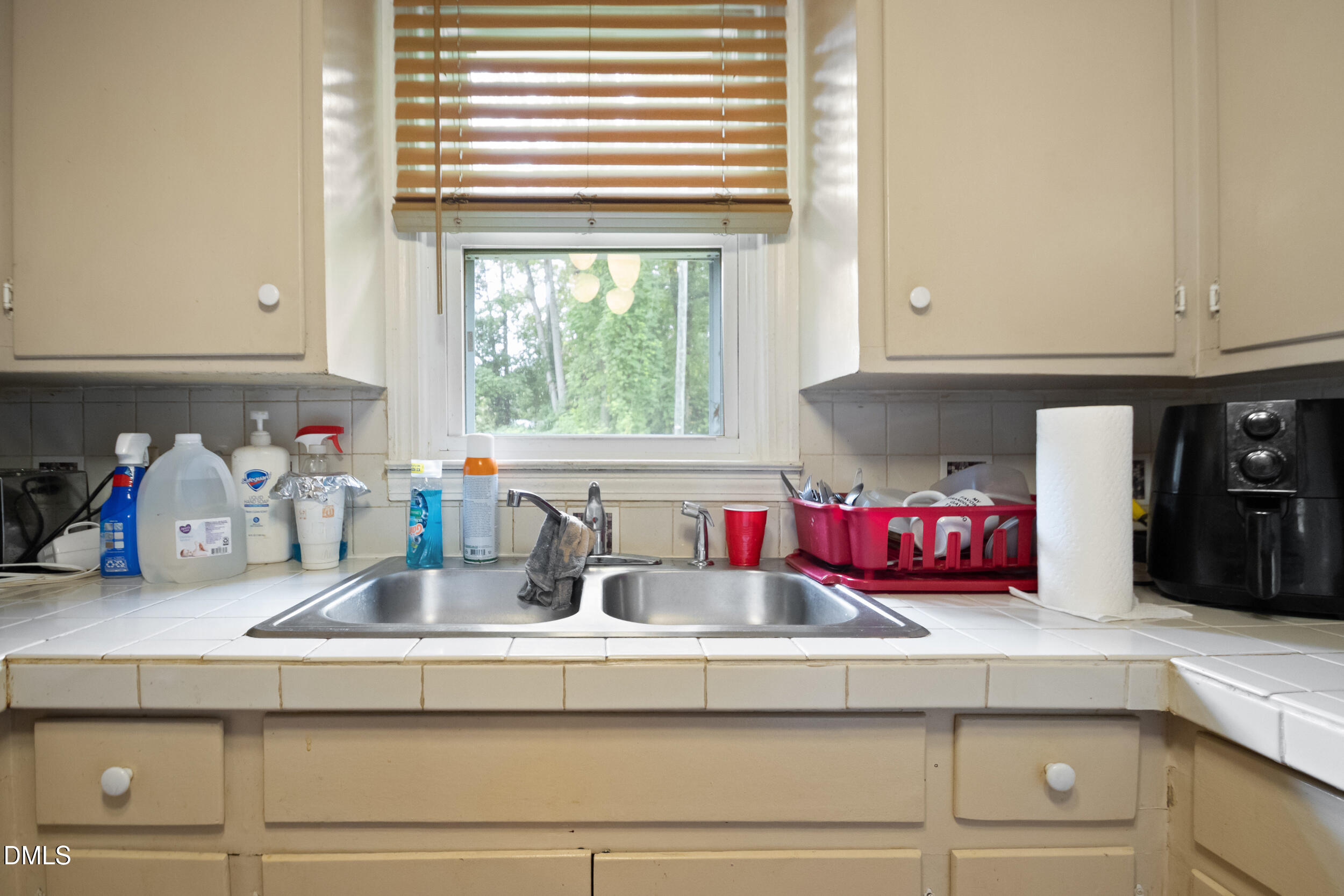 811 Jones Lester Road Roxboro, NC 27574 - Photo 13 of 27 a kitchen with sink cabinets and window