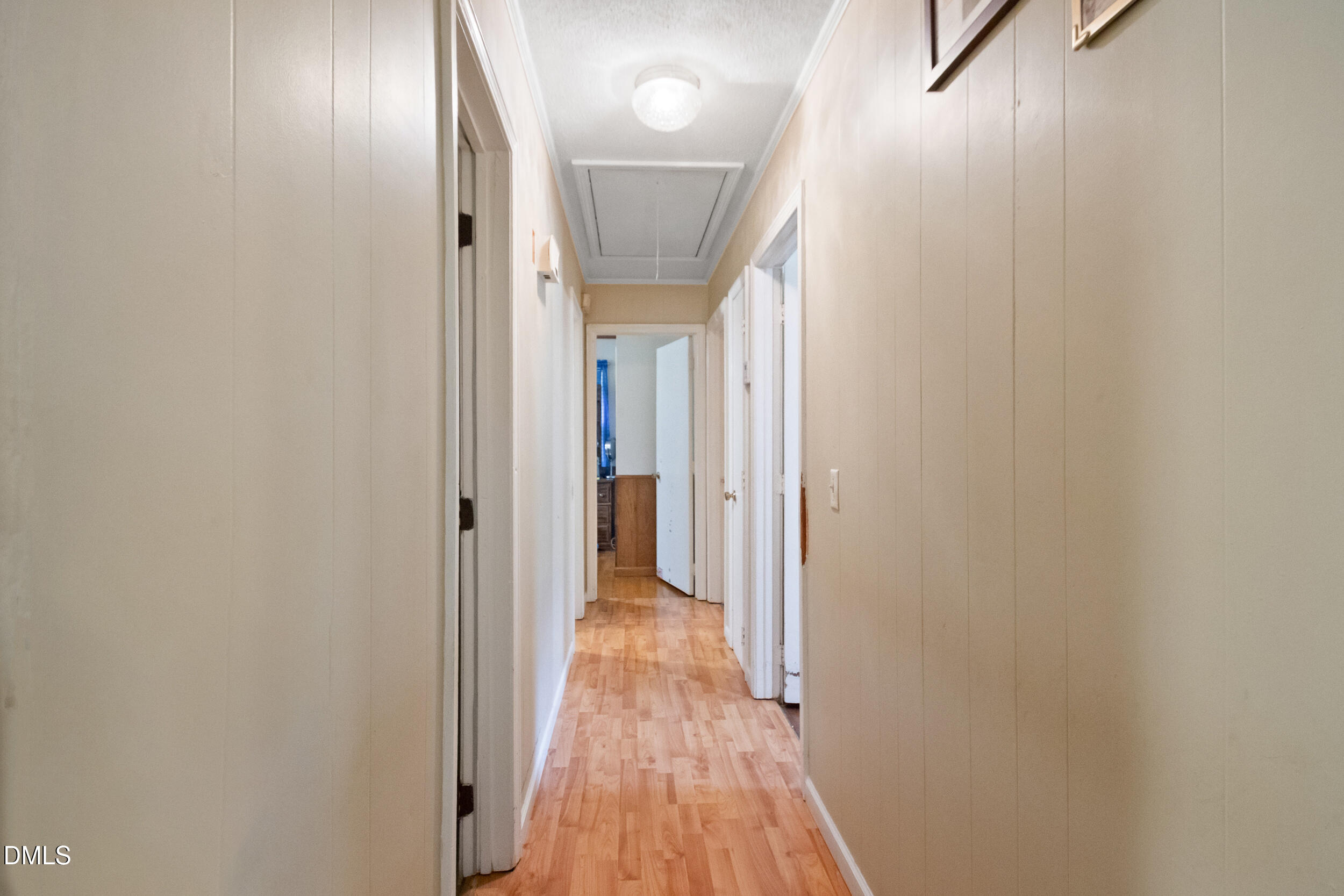 811 Jones Lester Road Roxboro, NC 27574 - Photo 14 of 27 a view of a hallway with wooden floor