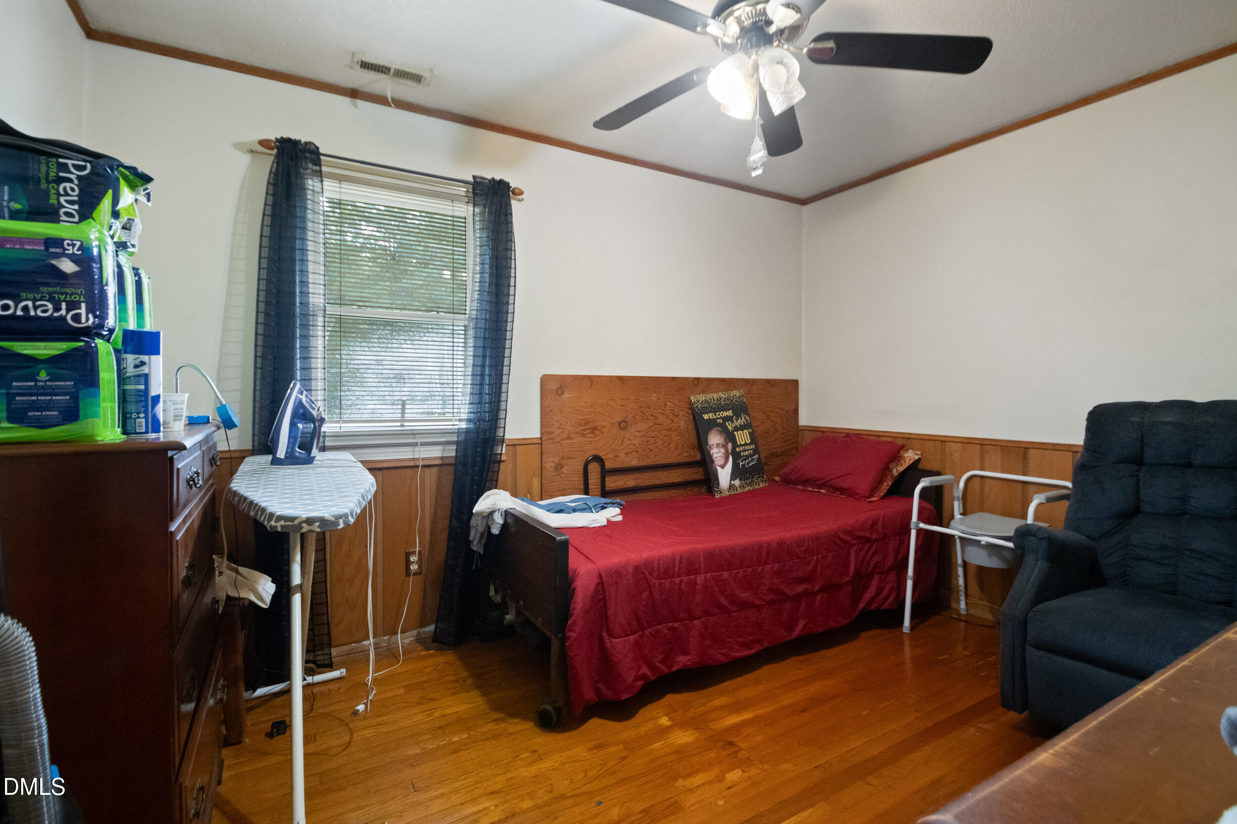 811 Jones Lester Road Roxboro, NC 27574 - Photo 15 of 27 a bedroom with furniture and a large window
