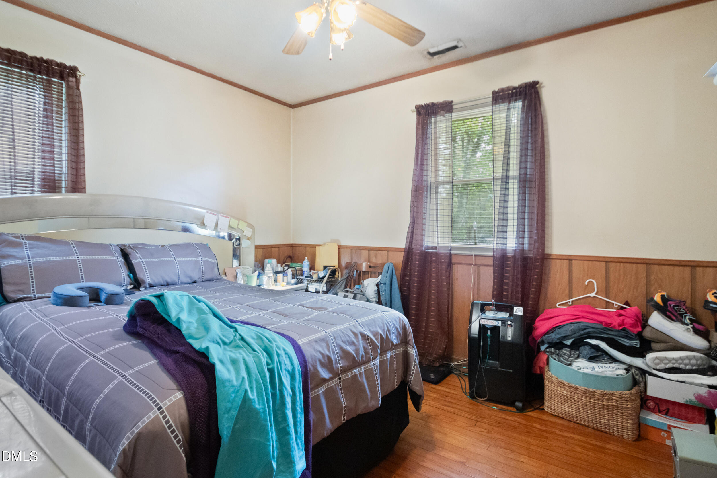 811 Jones Lester Road Roxboro, NC 27574 - Photo 16 of 27 a bedroom with two beds and a chandelier