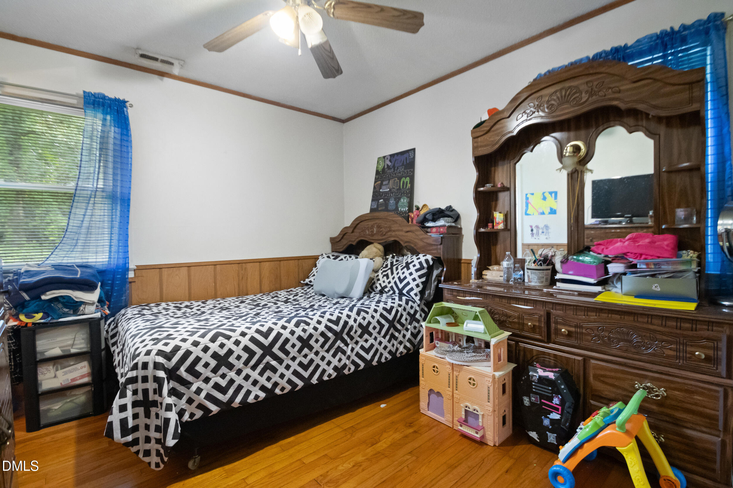 811 Jones Lester Road Roxboro, NC 27574 - Photo 17 of 27 a bedroom with a bed and large windows