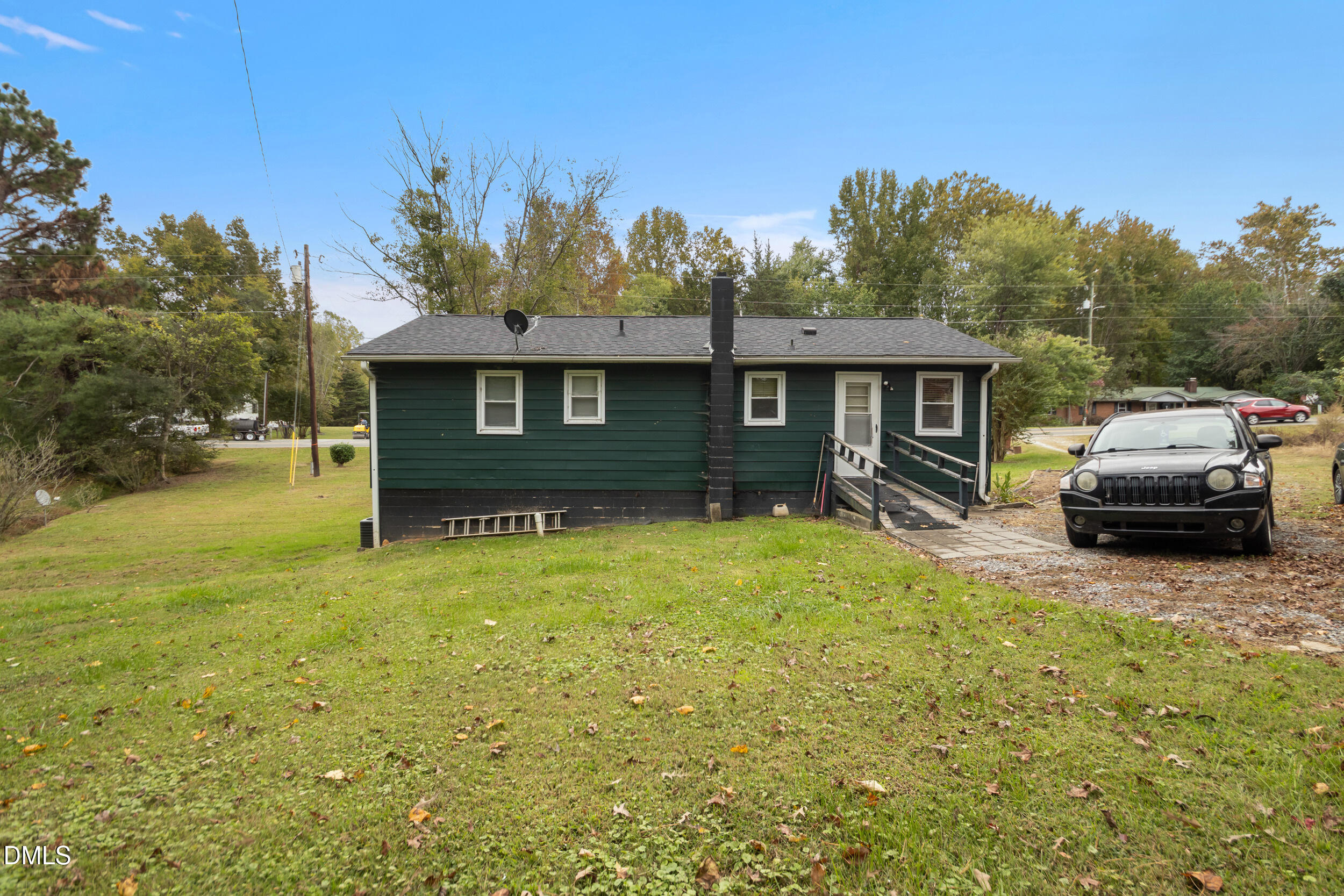 811 Jones Lester Road Roxboro, NC 27574 - Photo 25 of 27 a front view of a house with a garden