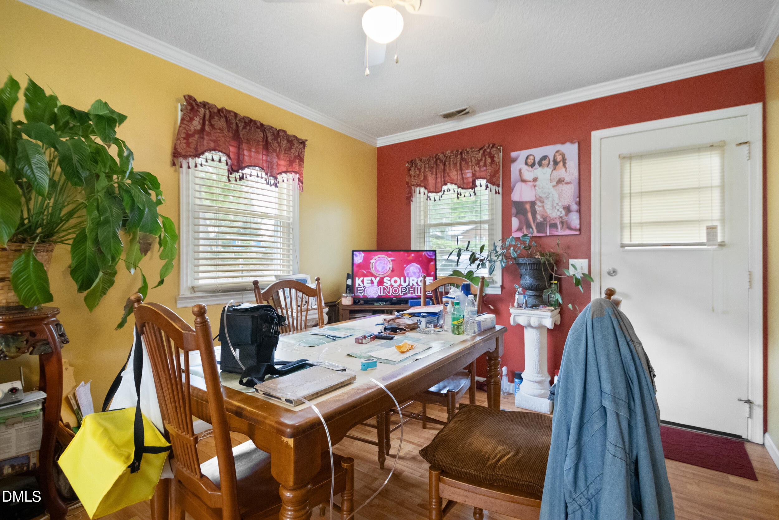 811 Jones Lester Road Roxboro, NC 27574 - Photo 5 of 27 a view of a dining room with furniture and wooden floor
