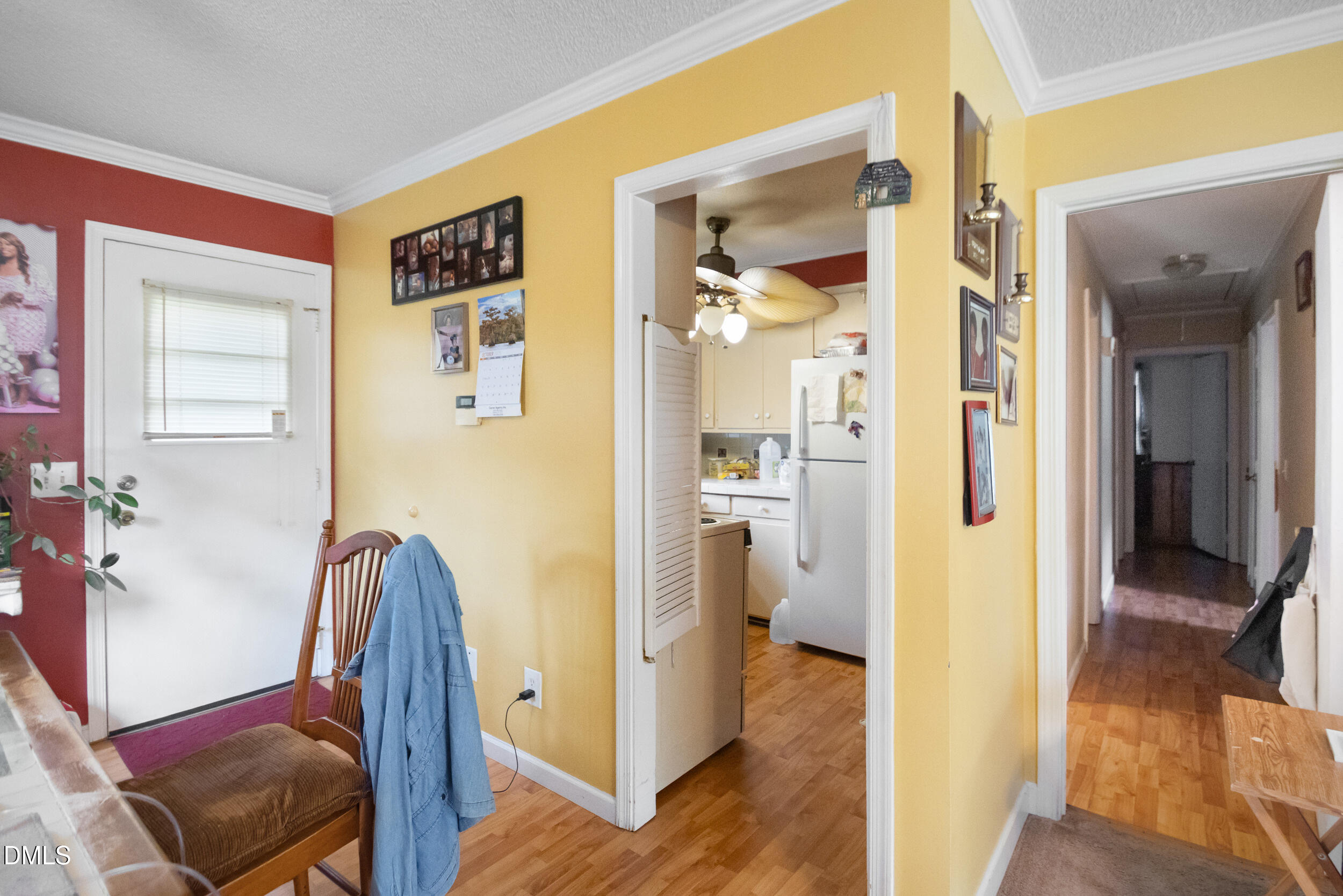 811 Jones Lester Road Roxboro, NC 27574 - Photo 8 of 27 a view of a hallway with bathroom and wooden floor