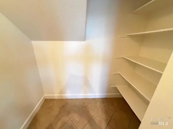 a view of a livingroom with wooden floor and fireplace