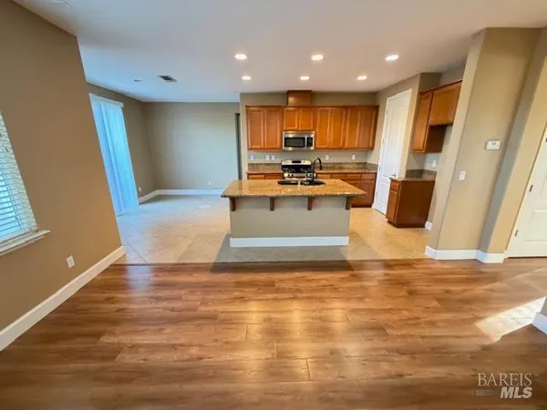 a view of hallway with wooden floor