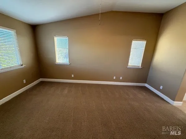 a bathroom with a double vanity sink a mirror and a bathtub