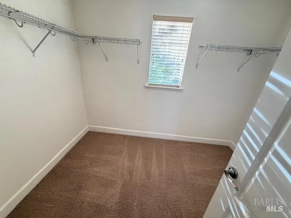 a view of a hallway with a large window