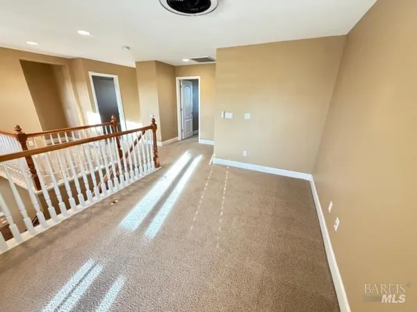 a bathroom with a granite countertop sink a mirror and a bathtub