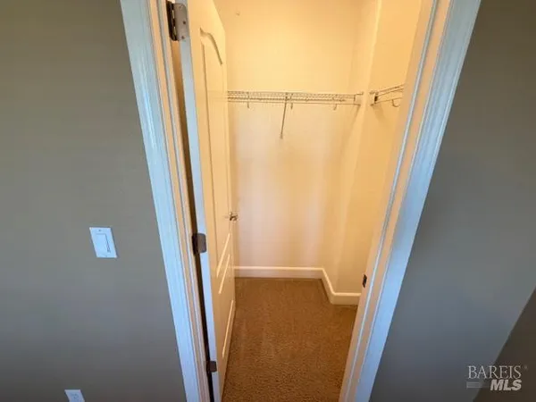 an empty room with a mirror