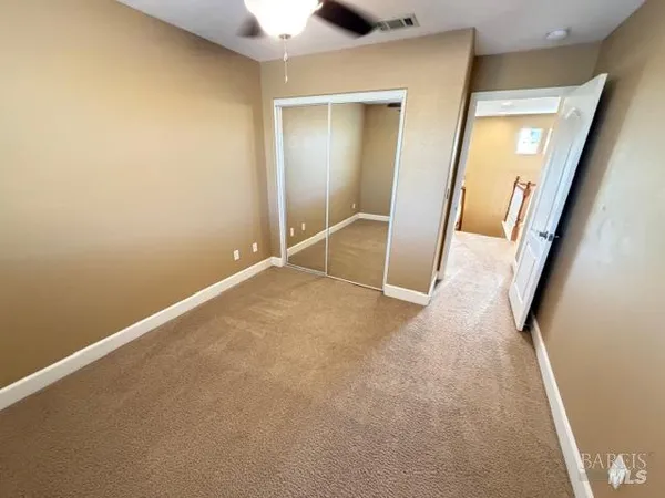 a view of a room with wooden walls