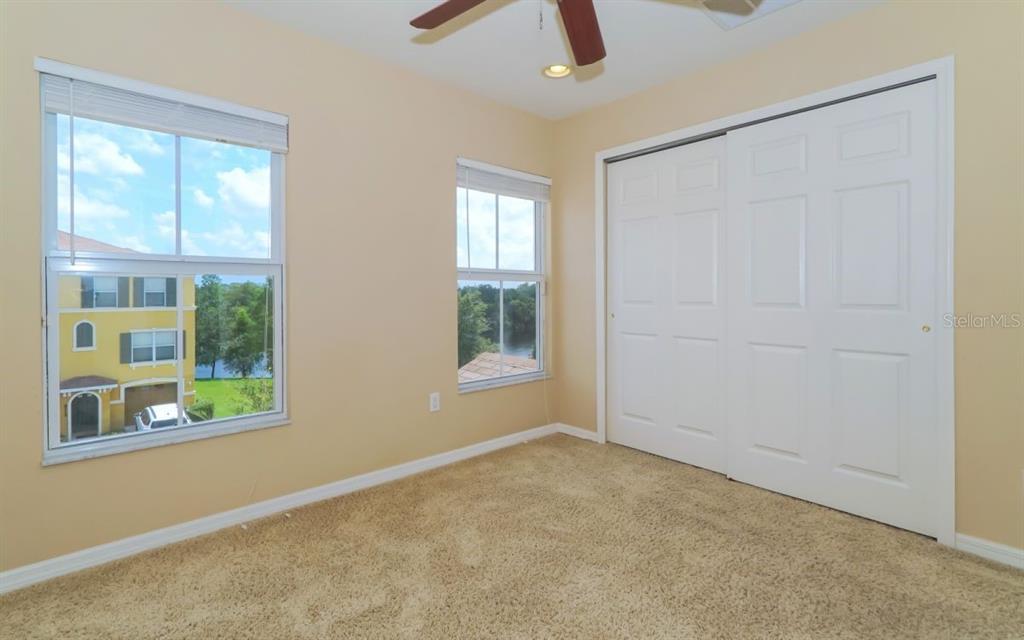 7339 Black Walnut Way Lakewood Ranch, FL 34202 - Photo 17 of 27 an empty room with windows