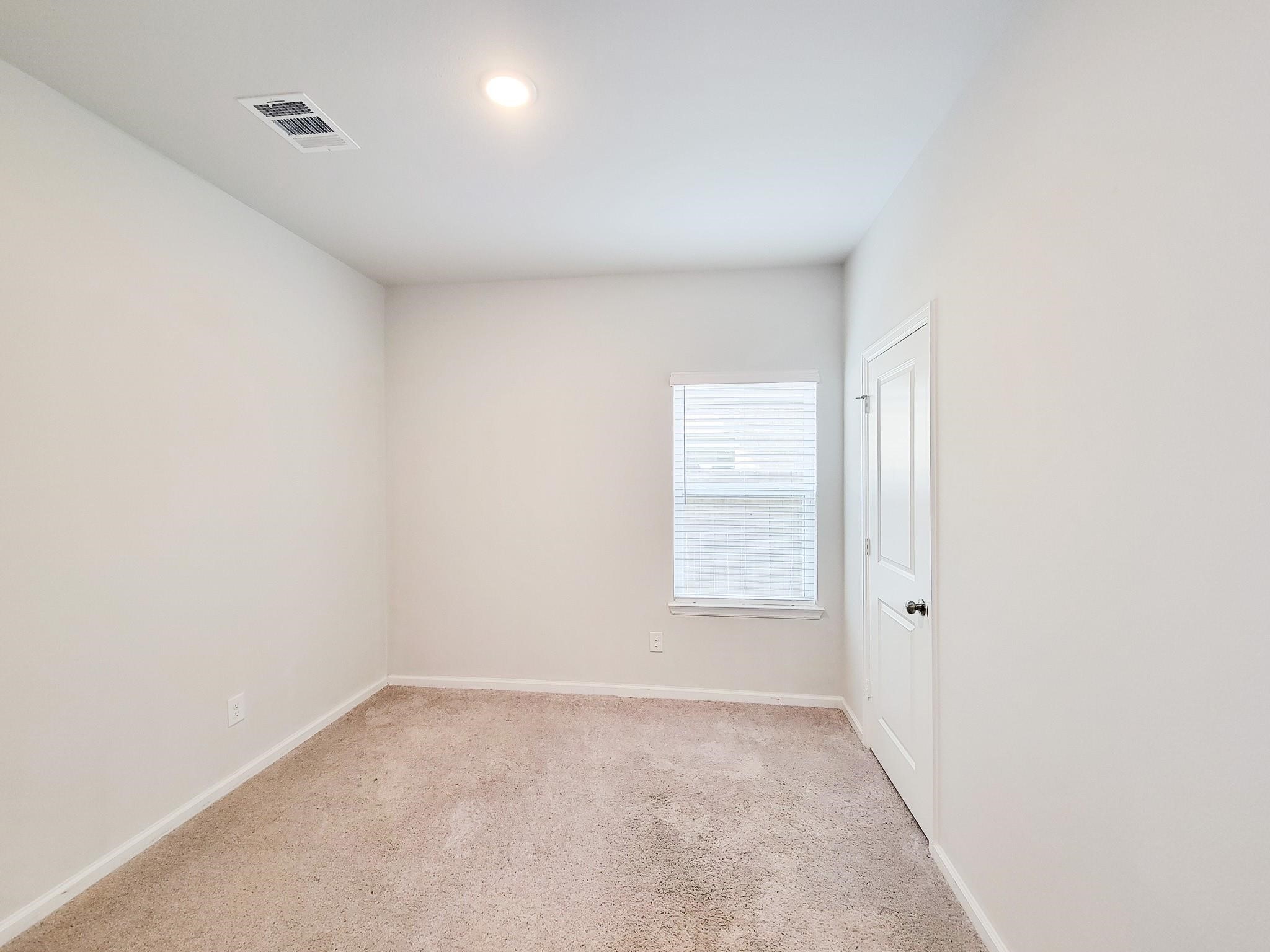 94 Valiant Ridge Trail Magnolia, TX 77354 - Photo 18 of 45 an empty room with a window
